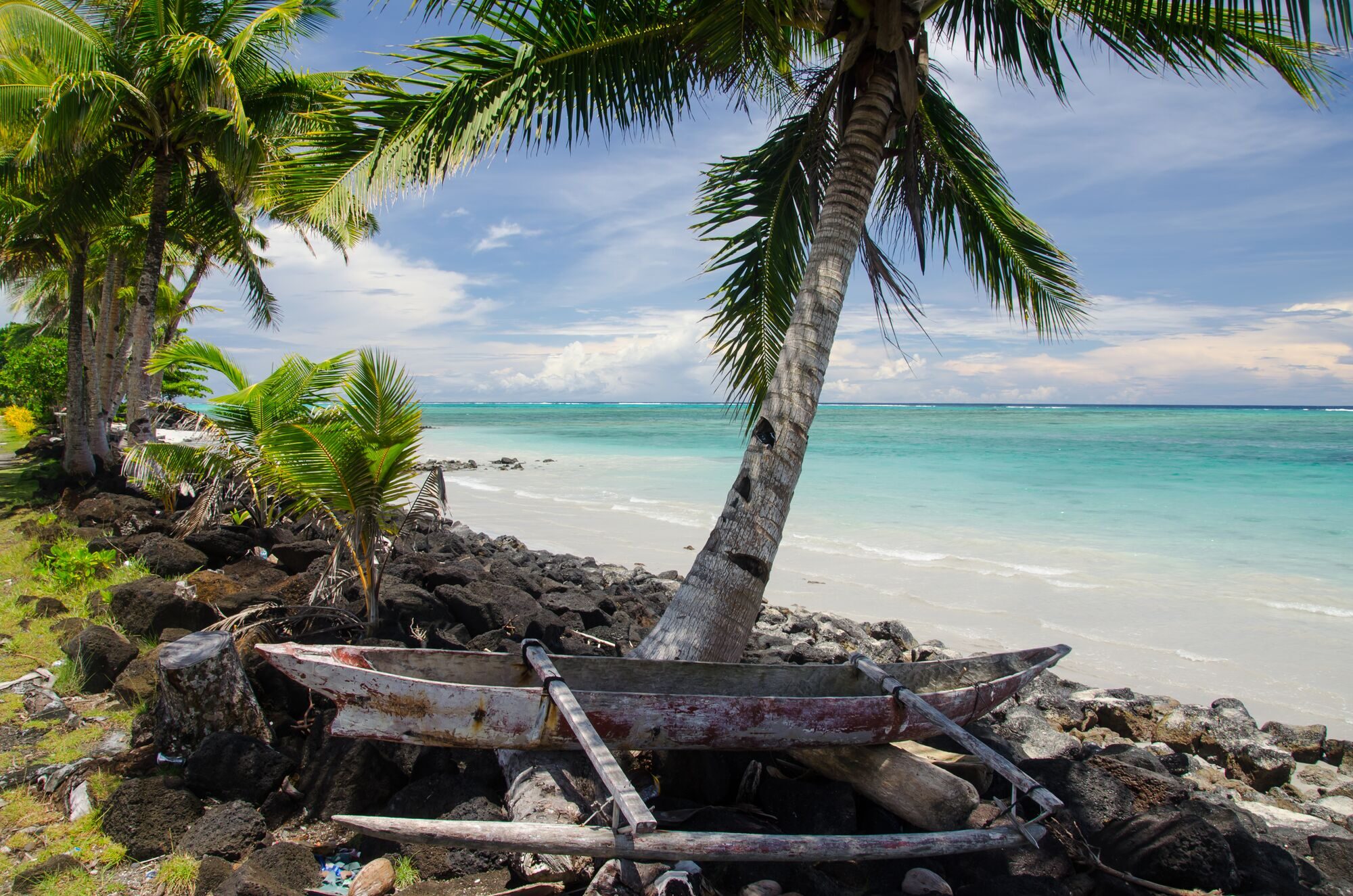 old-wooden-boat-shore-surrounded-by-sea-palm-trees-savai-i-island-samoa