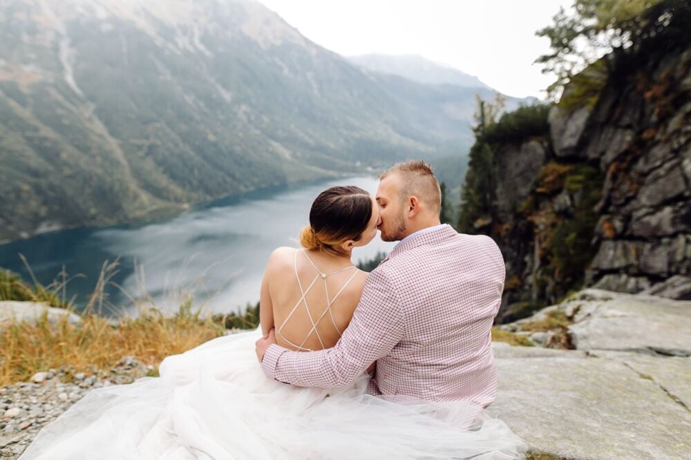 romantic-wedding-couple-love-standing-sea-eye-lake-poland-tatra-mountains