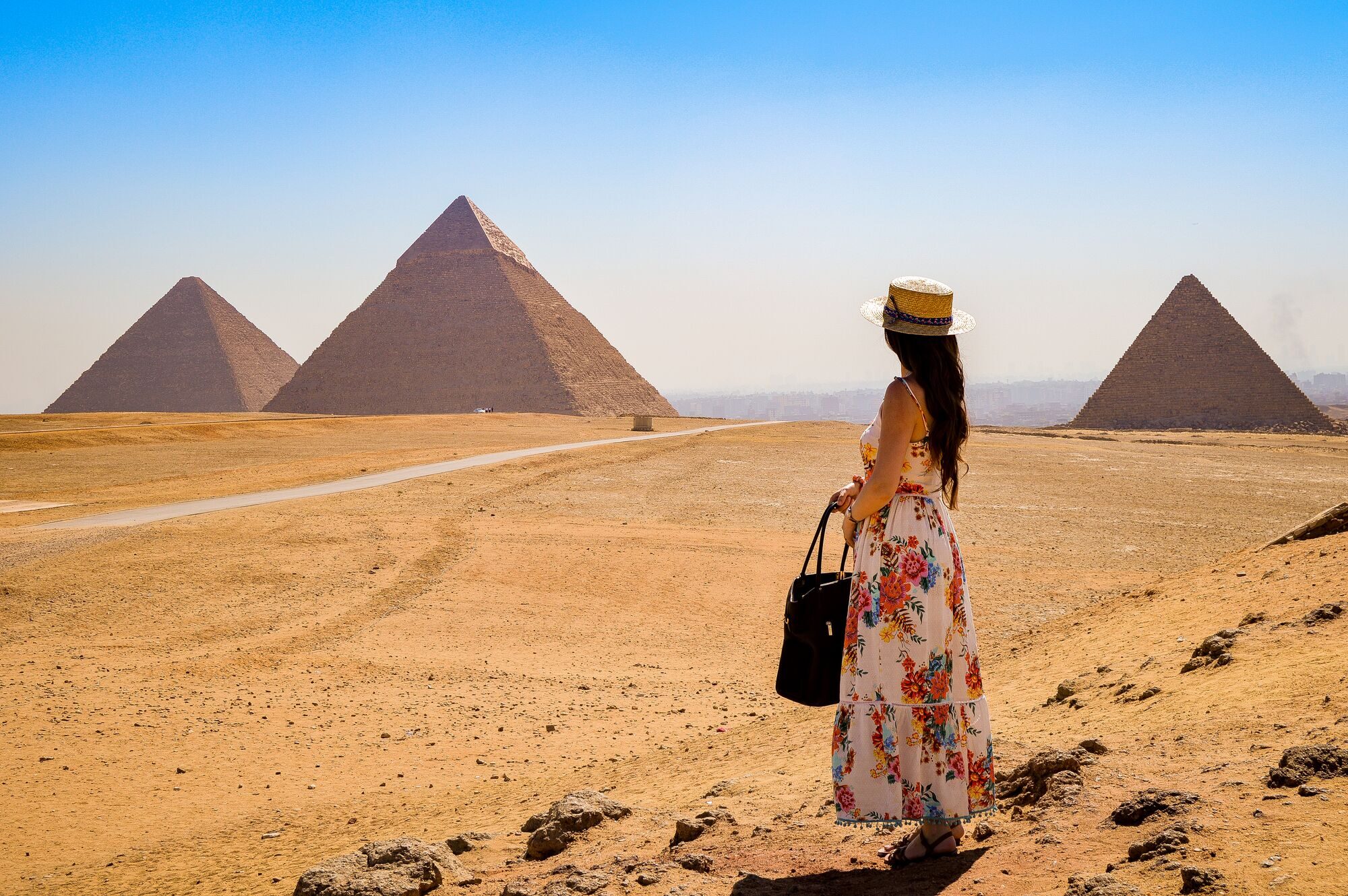 young-woman-visiting-pyramids-egypt